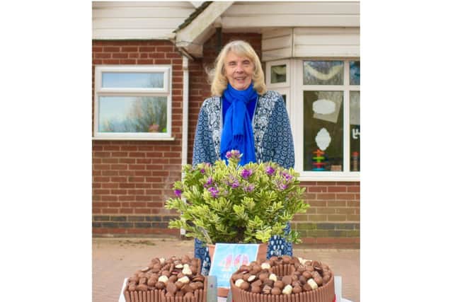 Pauline Weighell with the celebration cakes. Photo supplied