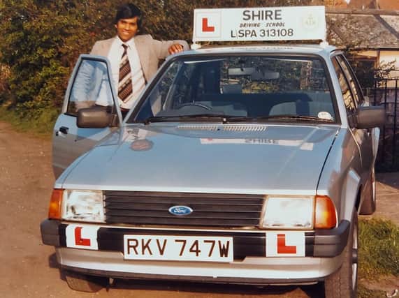 Dharam Veer Awesti set up the Shire Driving School on April 1 (April Fool's Day) 1981. He is pictured here with the Ford Escort Mk1 which was the first car he used to teach learners in.