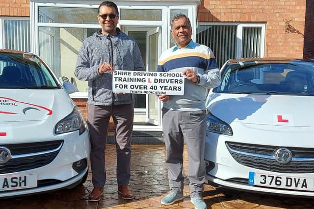 Dharam Veer Awesti with his son Ash (left) with the Vauxhall Corsas they teach learners in today.