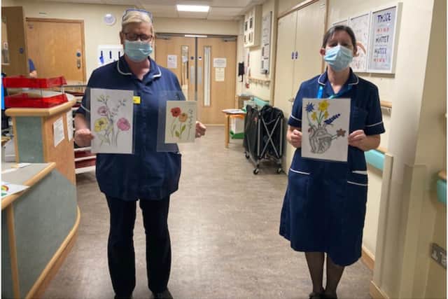 Ward Manager and Sister on Feldon Ward with motivational quotes. Photo supplied