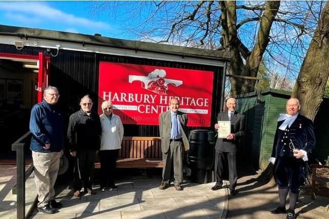High Sheriff Joe Greenwell, left, presenting the certificate to vice chairman David Turner and other members of the Harbury Heritage Group Committee outside the newly refurbished centre. Photo supplied