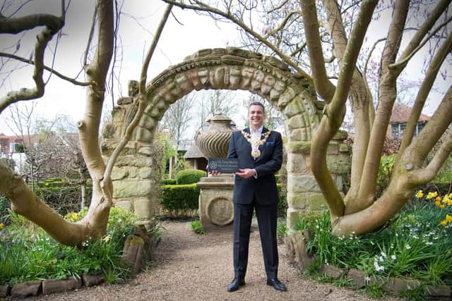 The Mayor of Warwick holding one of the special paving stones. Photo by Gill Fletcher