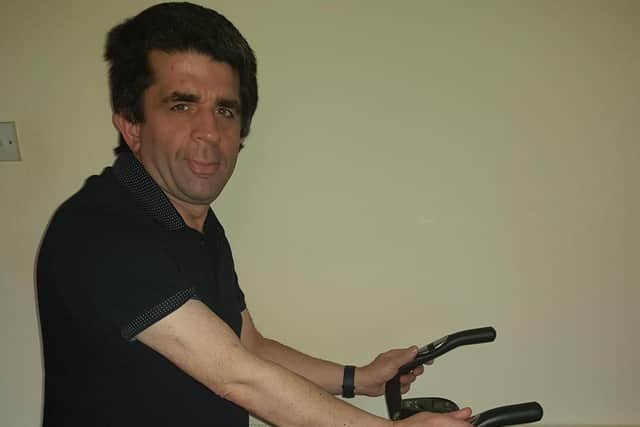 Doug Langley taking on the charity challenge on his exercise bike at home.