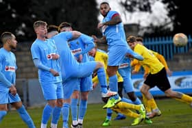 The wall does its job in Rugby Town's last game on February 8, a 2-0 win over Harborough Town   Picture by Martin Pulley