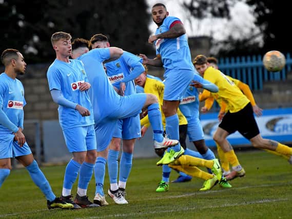 The wall does its job in Rugby Town's last game on February 8, a 2-0 win over Harborough Town   Picture by Martin Pulley