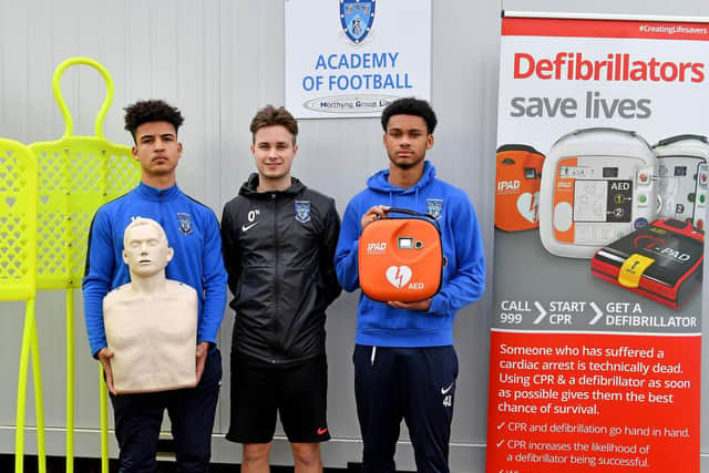 Academy players Matt Costa and Lee Padmore, with Academy Coach Joe O'Neill (centre) at the defibrillator presentation