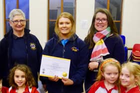 Olivia with her mother, past President of Warwick Lions Pauline Fanti and members of the St Marks Rainbow Guides. Photo supplied