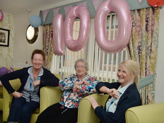 Nurses Sandra Sperry and Tammi Green celebrate with 100 year old Pat Carpenter at Hazeland Court.
PICTURE: ANDREW CARPENTER