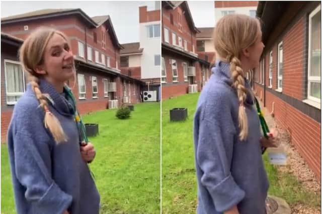 Hannah Ciotkowski singing outside the windows at Warwick Hospital. Photos from Youtube video by Jill Fraser.