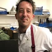 Aubrey Allen chef, Andy Clarke with donated produce, starts preparing the meals. Photo supplied