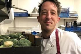 Aubrey Allen chef, Andy Clarke with donated produce, starts preparing the meals. Photo supplied