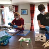Grace and Leo Dugal making visors