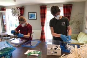 Grace and Leo Dugal making visors