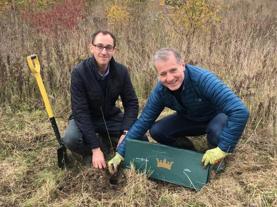 Mr Pawsey (right) and Cllr Yousef Dahmash (left) planting trees in the Rugby's Diamond Wood. Photo taken before social distancing measures were announced.