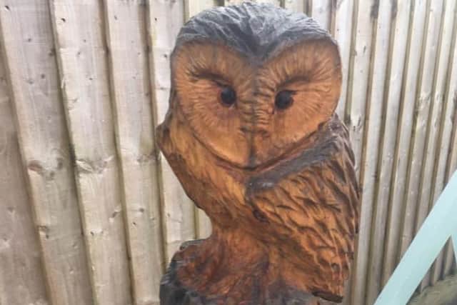 Wood owl garden sculpture