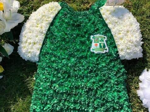A flower arrangement of a Leamington Hibernian FC shirt made for and laid on the grave of Joy Barry.