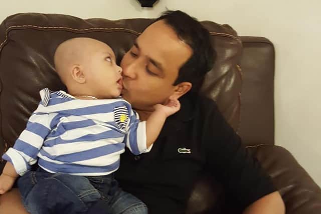Baabzi Miah with his son Adam. Photo supplied
