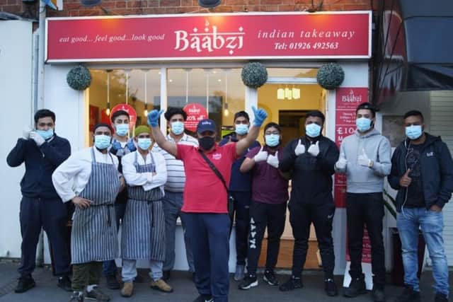 Baabzi Miah and the team outside the takeaway in Warwick. Photo supplied.