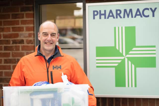 One of the Covid-19 Support Kenilworth group's Pharmacy Army 'Pharmy Army' team makes a collection of prescriptions for delivery.