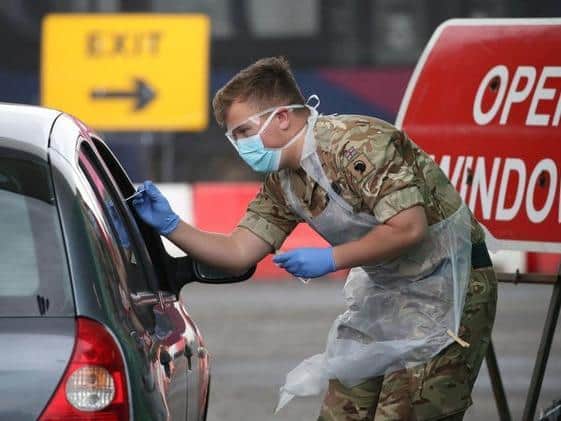 FILE IMAGE: A soldier from 2nd Scots Royal Regiment of Scotland takes a test sample at a Covid-19 testing centre at Glasgow Airport (Photo: Andrew Milligan-WPA Pool/Getty Images) Copyright: Getty Images.