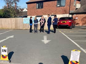 Abbey Medical Centre staff at the setting up of the drive-thru bays at the car nearby car park.