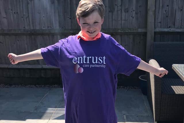 Freddie wearing his Entrust Care Partnership t-shirt. Photo supplied