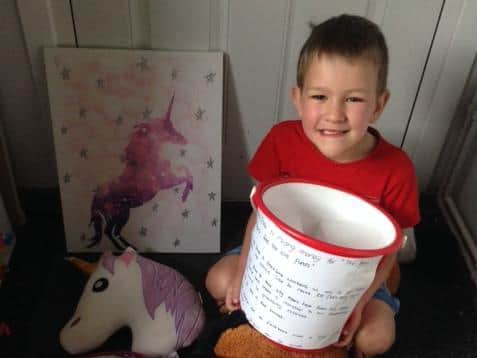 Noah-jake Bowell with his donation bucket. Photo supplied
