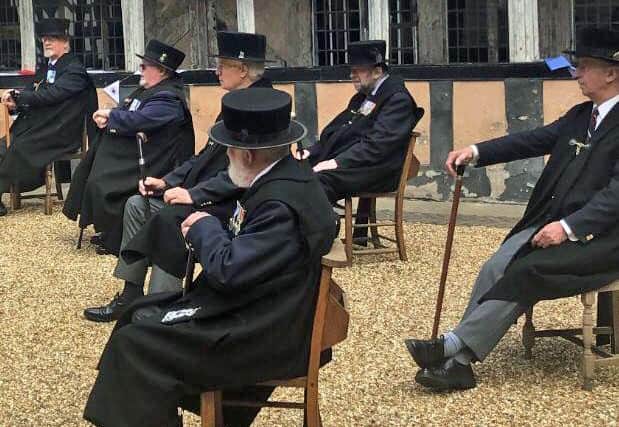 The Brethren at the Lord Leycester Hospital listening to the performance by Kissing it Better. Photo supplied