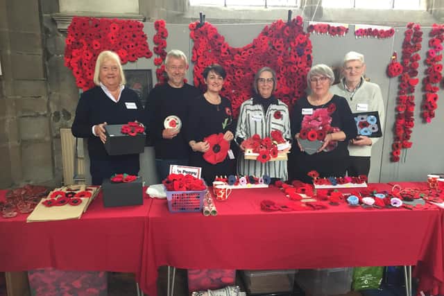 Some of the Warwick Poppies team at one of their poppy sale days in St Mary's Church.