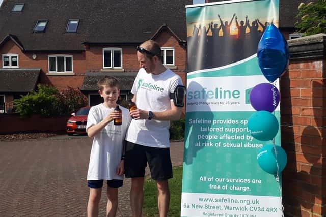 Henry with his dad after finishing his challenge. Photo supplied