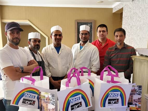 Rayes Hussain (left) with staff at the Indian Ark in Kenilworth. The restaurant made 100 free set meals for staff at Warwick Hospital.