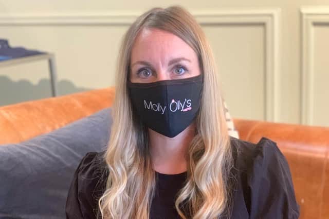 Sally James wearing one of the Molly Olly's masks. Photo supplied