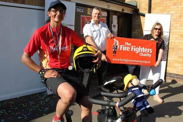Alison Insley with Kieran Amos, Warwickshire Chief Fire Officer and Debbie Rushbrooke, regional fundraiser for the Firefighters Charity. Photo supplied