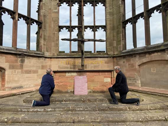 The Right Reverend Dr Christopher Cocksworth (Bishop of Coventry)and the Right Reverend John Stroyan (Bishop of Warwick) 'took the knee' in front of the Charred Cross in the Cathedral Ruinsto mark two weeks since the deathof George Floyd in the USA.