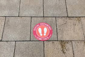 A pavement sticker for social distancing in Leamington town centre.