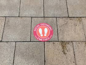 A pavement sticker for social distancing in Leamington town centre.