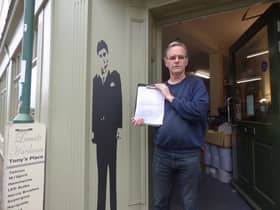 Paul Lamat of Lamat's Hardware with the petition outside the shop in Old Town, Leamington.
