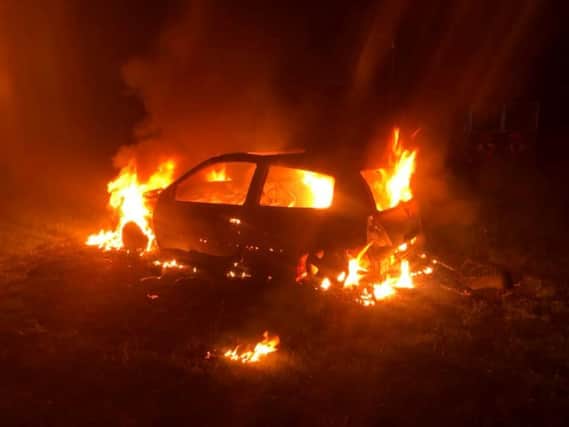 The car on fire at Castle Hill skate park. Photo courtesy of Kenilworth fire station.