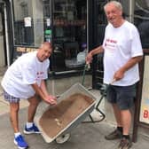 Kevin Murphy (left) makes a donation to Fred Hepburn on one of Fred's walks to Murphy's Bar in Leamington as part of his 500-mile challenge.