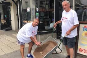 Kevin Murphy (left) makes a donation to Fred Hepburn on one of Fred's walks to Murphy's Bar in Leamington as part of his 500-mile challenge.