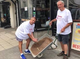 Kevin Murphy (left) makes a donation to Fred Hepburn on one of Fred's walks to Murphy's Bar in Leamington as part of his 500-mile challenge.