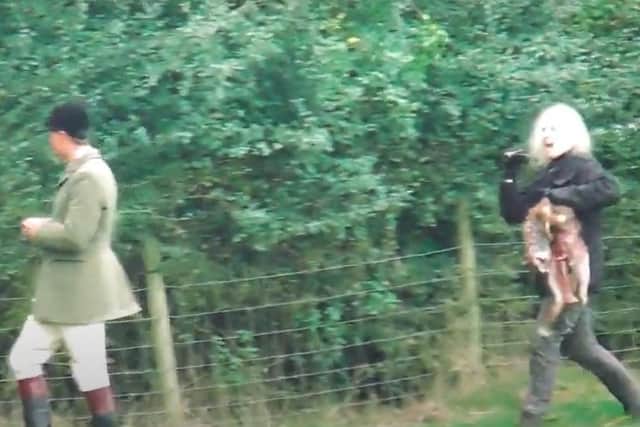 This video by the West Midlands Hunt Saboteurs shows an anti-hunt campaigner confronting a huntsman with dead fox in south Warwickshire after she dragged it out of the mouths of hounds