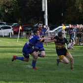 OLs' Jonny Ure heads to the line for a try