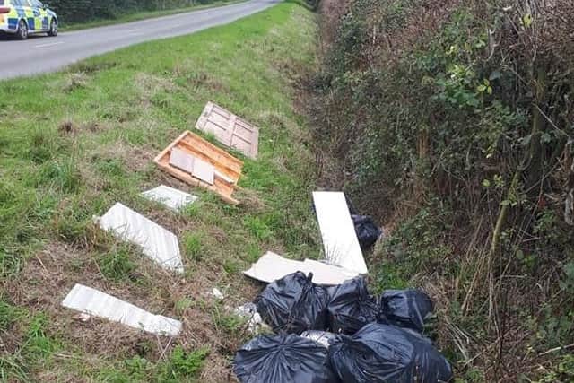 Fly tippers have dumped a large amount of rubbish next to a country road near Leamington. Photo by Kenilworth and Warwick Rural Police.