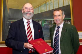 (l-r) Norman Hyde with his book Tennis: The Leamington Way and and Andy Dixon who is the chairman of Leamington Tennis Court Club.