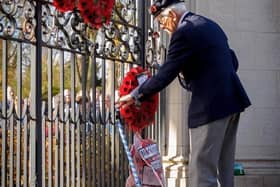 A Rugby veteran lays a wreath at the Memorial Gates during a previous year's Remembrance ceremony.