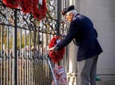A Rugby veteran lays a wreath at the Memorial Gates during a previous year's Remembrance ceremony.
