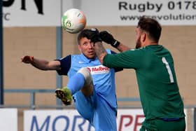David Kolodynski challenges the keeper