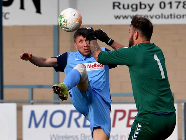 David Kolodynski challenges the keeper