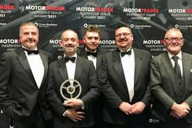 Some of the team from Just Nice Clean Cars in Warwick with the award. Photo supplied